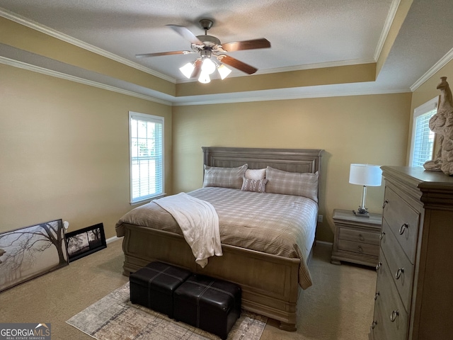 bedroom featuring ceiling fan, light carpet, and ornamental molding