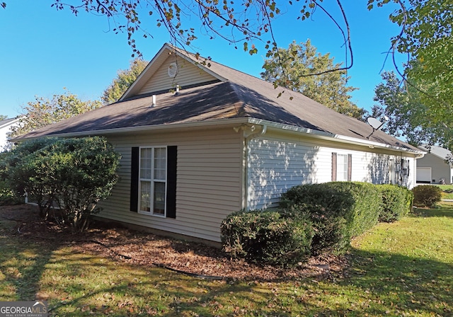 view of home's exterior featuring a yard