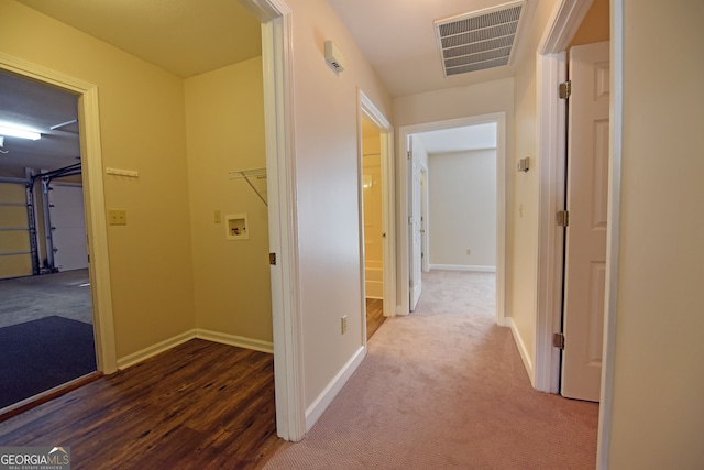 hall with dark hardwood / wood-style flooring