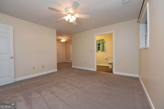 carpeted empty room featuring ceiling fan