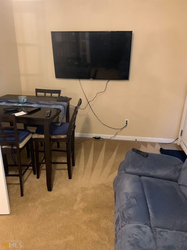 dining area featuring carpet flooring