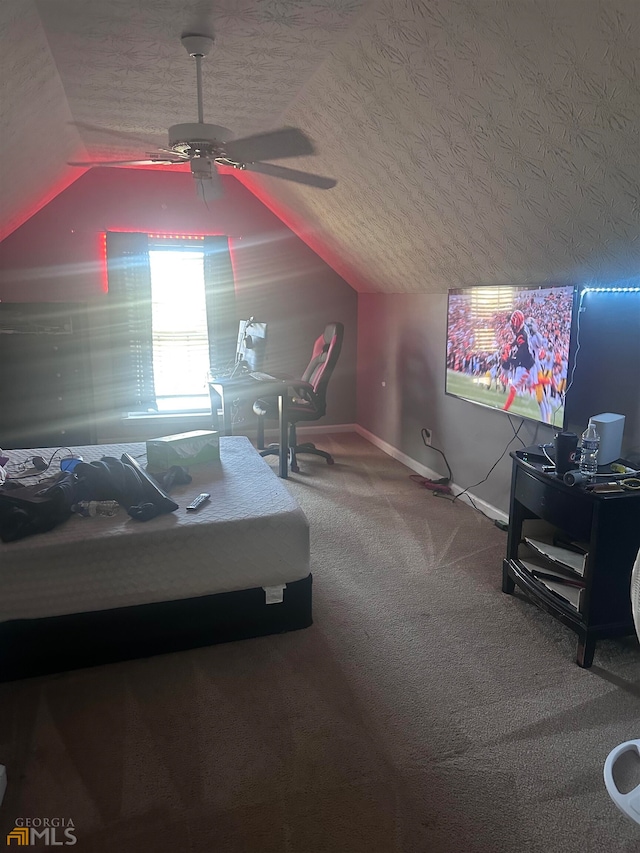 carpeted bedroom with lofted ceiling, a textured ceiling, and ceiling fan