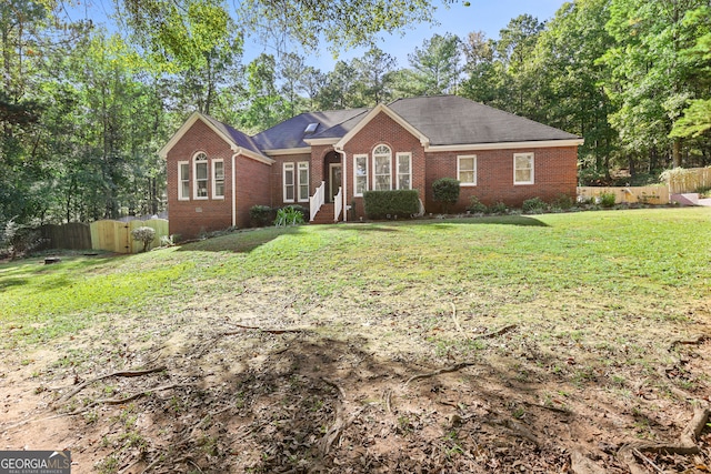 single story home with a front yard