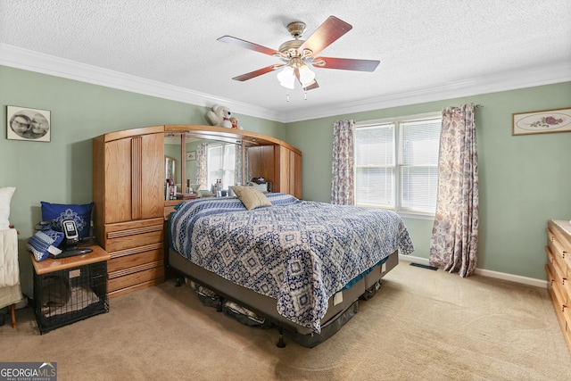 carpeted bedroom featuring ceiling fan, a textured ceiling, and ornamental molding