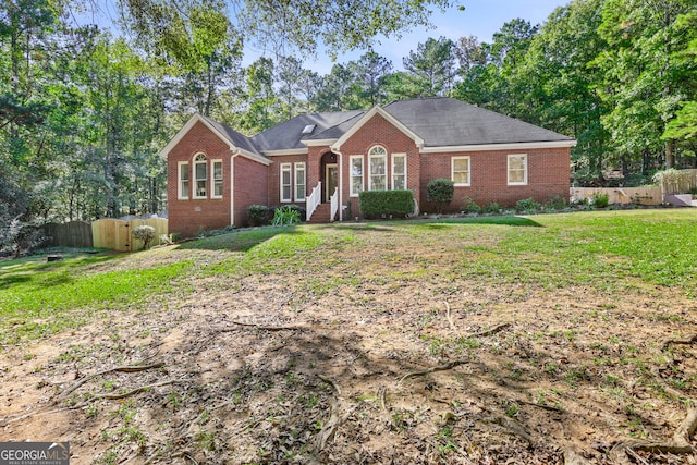 single story home with a front yard