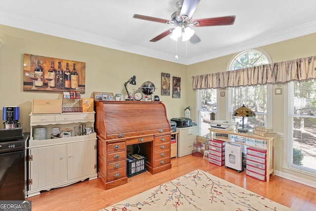 office area featuring crown molding, light wood-type flooring, and ceiling fan