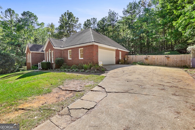 view of property exterior featuring a garage and a lawn