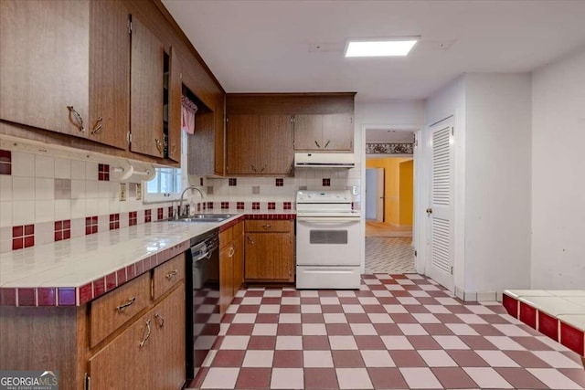 kitchen featuring black dishwasher, sink, white electric range, and tile counters