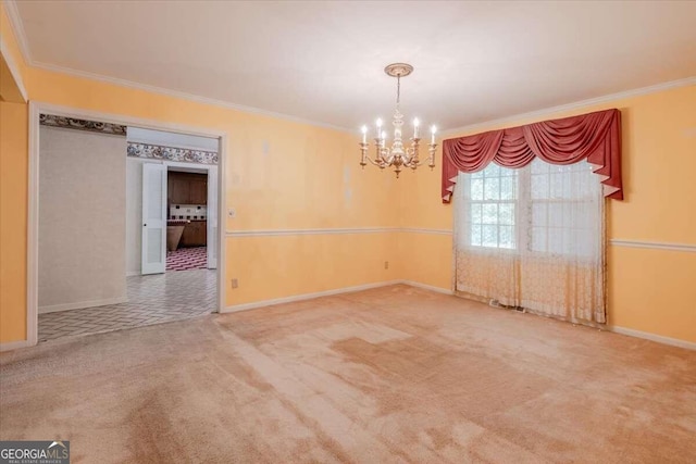 spare room with a notable chandelier, ornamental molding, and carpet floors