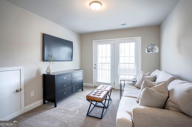 living room with light colored carpet