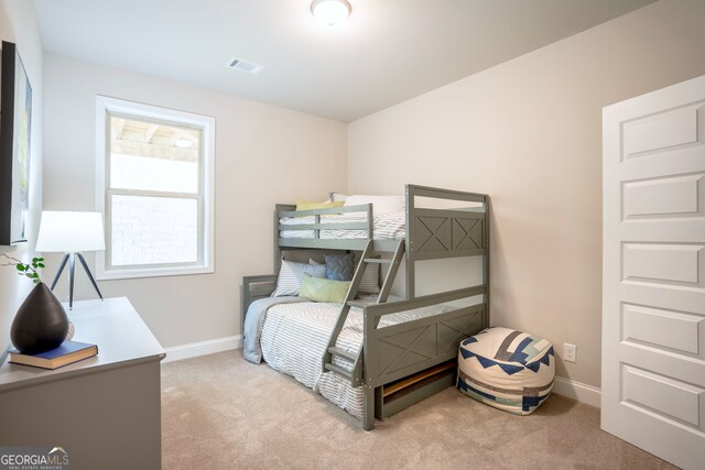 bedroom with light carpet