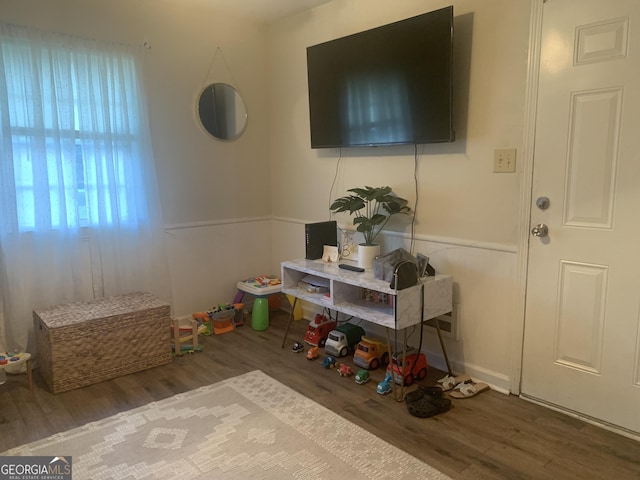 game room with hardwood / wood-style floors