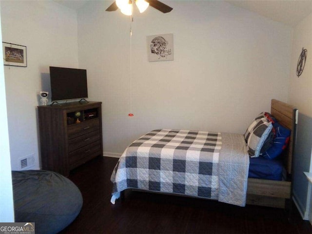 bedroom with dark wood-type flooring and ceiling fan