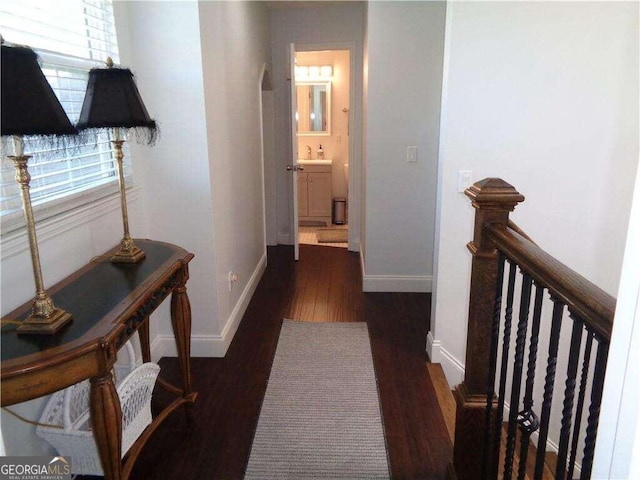 hall with dark hardwood / wood-style flooring