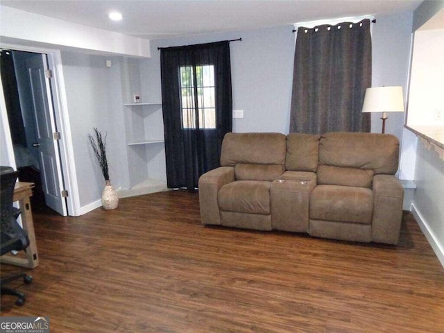 living room with dark wood-type flooring