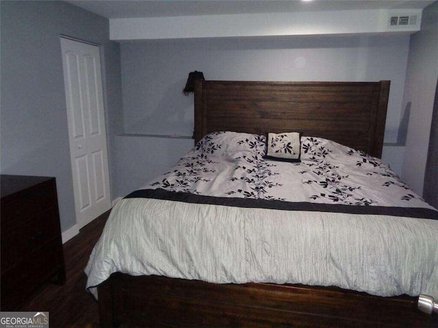 bedroom featuring dark hardwood / wood-style floors