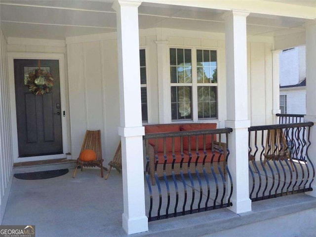 view of exterior entry featuring a porch