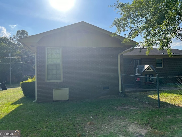 rear view of house with a lawn