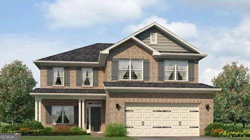 view of front of home with a front yard and a garage