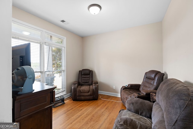 sitting room featuring light hardwood / wood-style floors