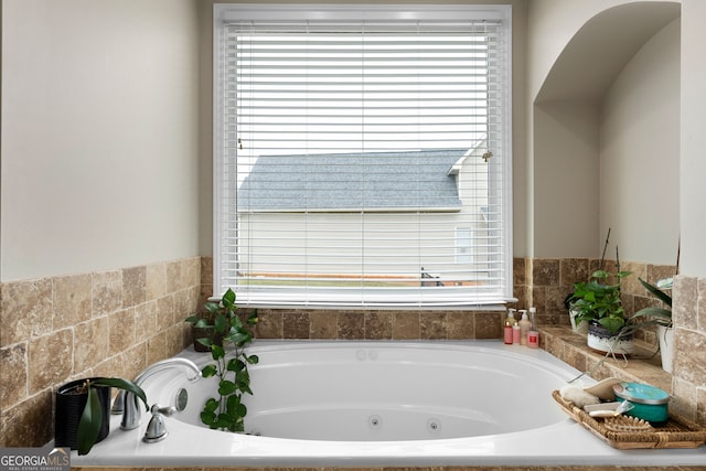 bathroom featuring a tub to relax in