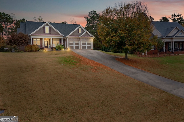 craftsman inspired home featuring a porch and a yard