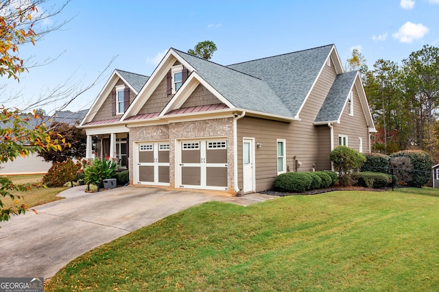 craftsman-style house with a garage and a front yard