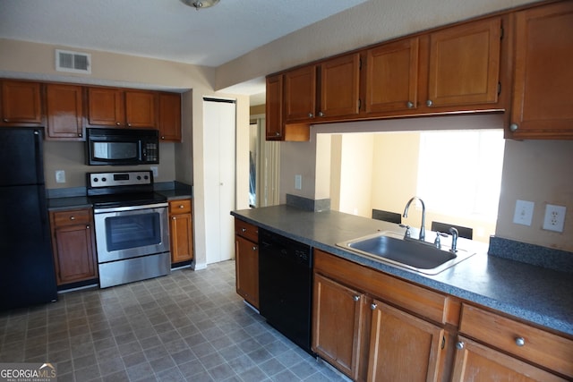 kitchen with sink and black appliances