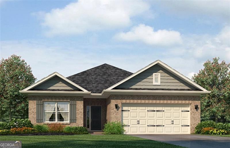 view of front of home with a front yard and a garage