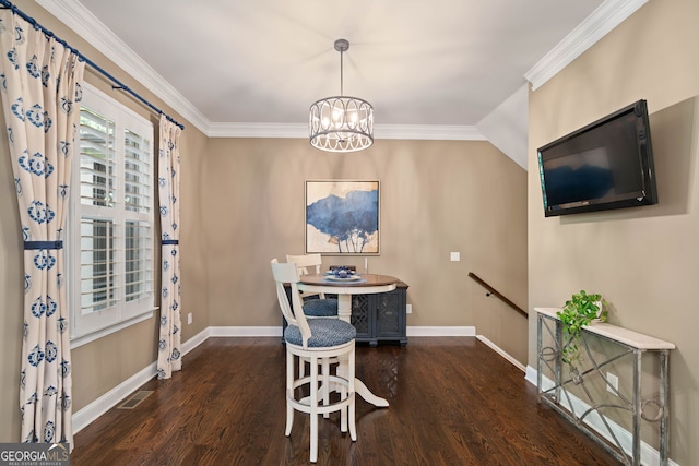 dining space with crown molding, a chandelier, and dark hardwood / wood-style flooring