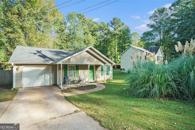 ranch-style home featuring a porch, a front lawn, and a garage