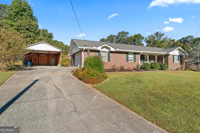 view of front of house with a front yard and a garage