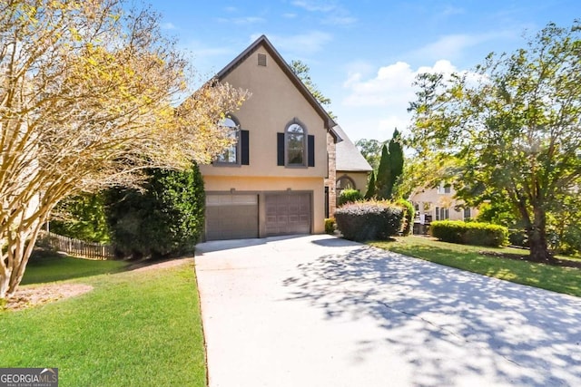 view of front of home featuring a garage and a front lawn