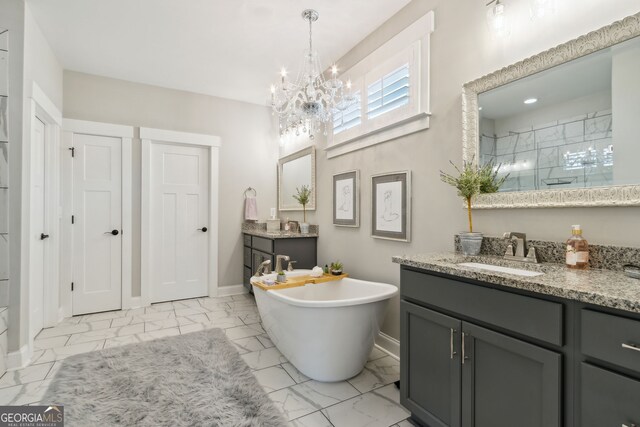 bathroom with vanity, marble finish floor, baseboards, and an inviting chandelier