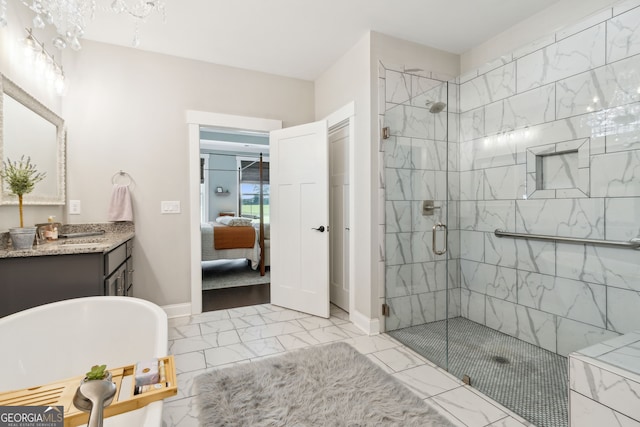full bath with a freestanding tub, marble finish floor, a stall shower, and connected bathroom