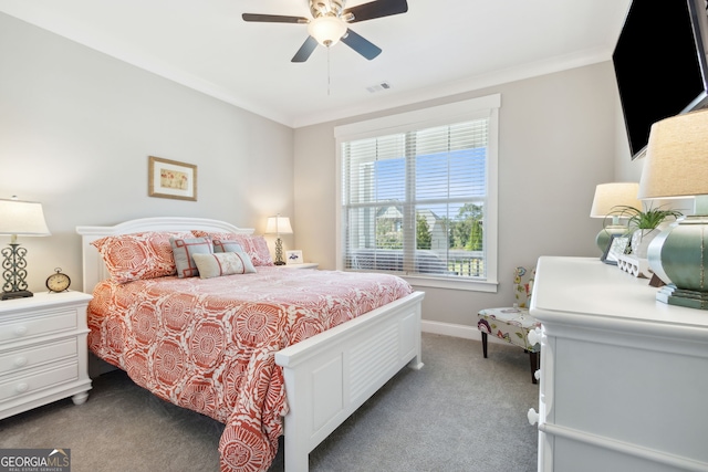 bedroom featuring crown molding, carpet flooring, baseboards, and a ceiling fan