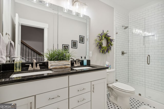 bathroom featuring vanity, toilet, tile patterned floors, and an enclosed shower