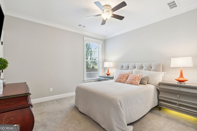 bedroom featuring light carpet, crown molding, and ceiling fan