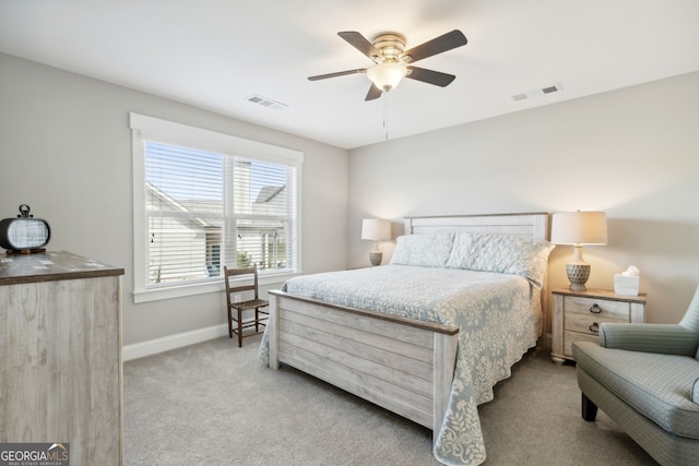 bedroom with ceiling fan, baseboards, carpet flooring, and visible vents