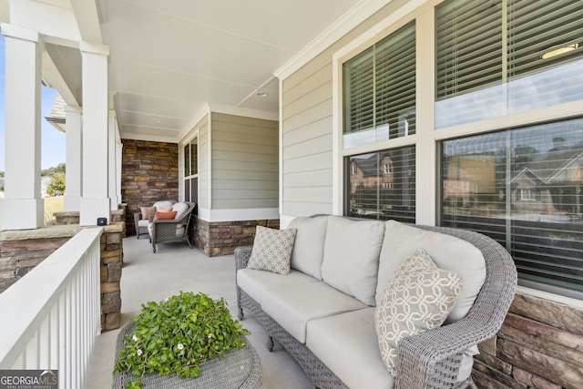 view of patio / terrace with a porch and outdoor lounge area