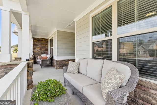 view of patio featuring a porch and an outdoor hangout area