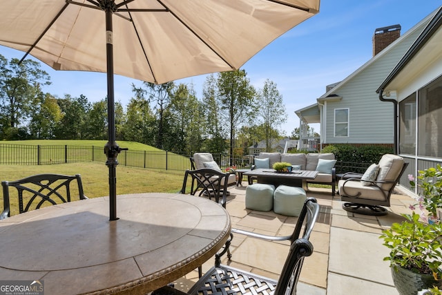 view of patio with a fenced backyard, outdoor dining area, and an outdoor living space