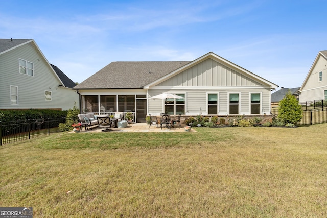 rear view of house with roof with shingles, a fenced backyard, board and batten siding, a yard, and a patio