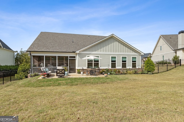 back of house featuring board and batten siding, a sunroom, fence, and roof with shingles
