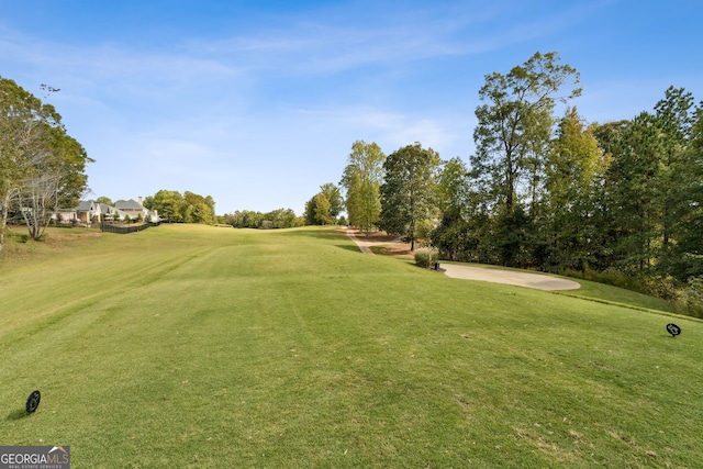 view of property's community with a lawn