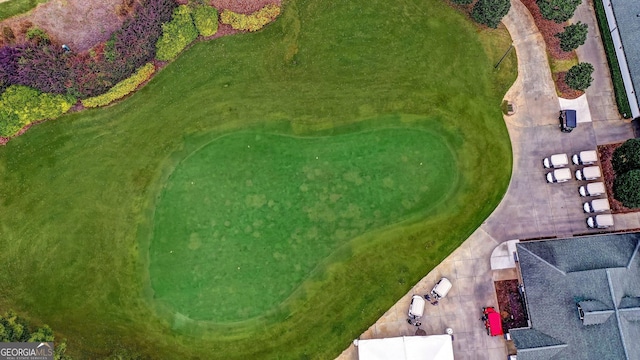 birds eye view of property with view of golf course