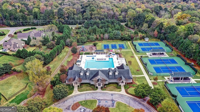 birds eye view of property with a forest view