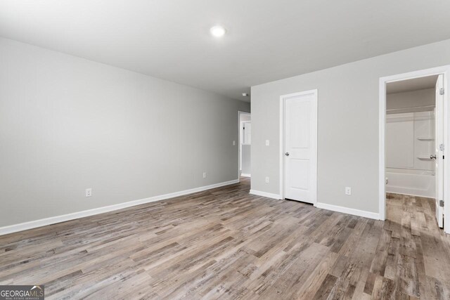 bathroom with tile patterned flooring, vanity, toilet, and walk in shower