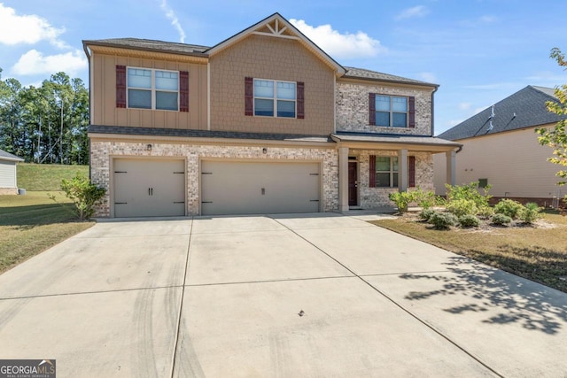 view of front of property with a garage, concrete driveway, a front lawn, and board and batten siding