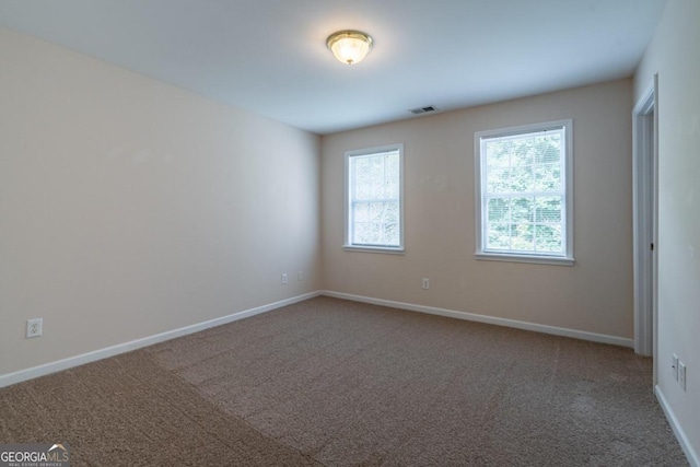 unfurnished room featuring carpet floors